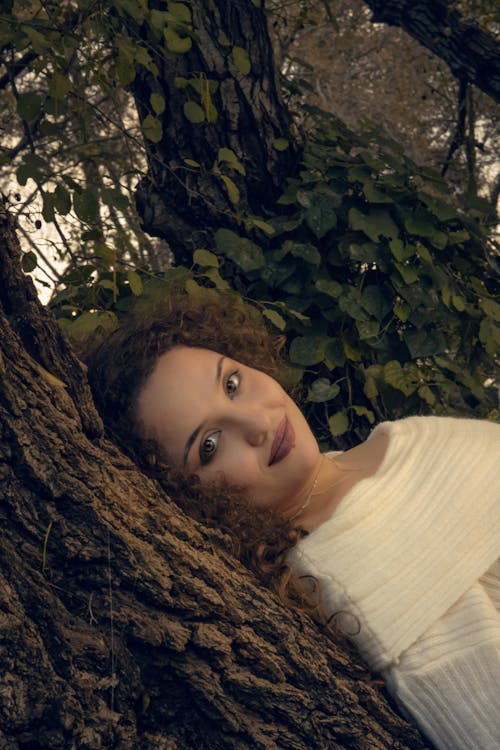 Portrait of Woman Leaning on Tree