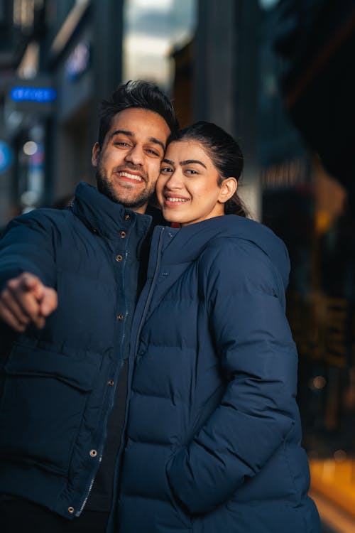 Portrait of Smiling Couple in Jackets