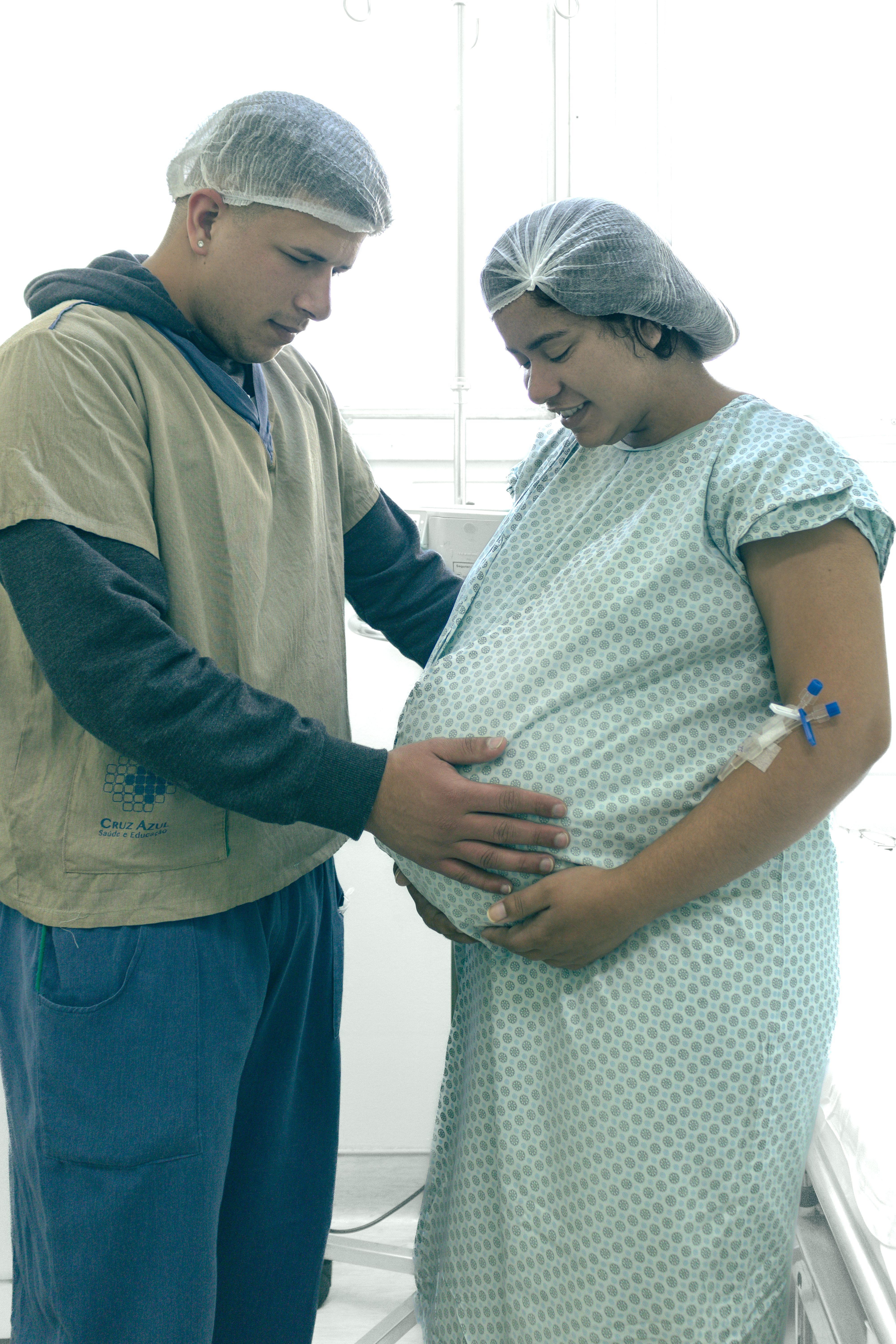 Pregnant woman and her partner together in a hospital room