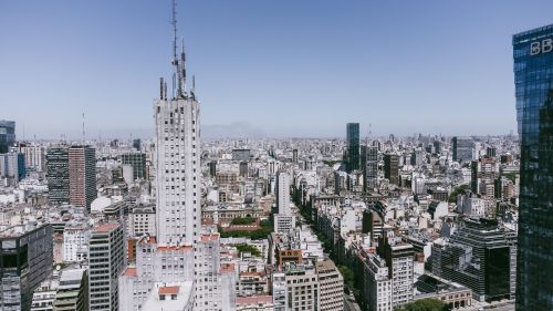 Free Stunning aerial view of Buenos Aires skyline with iconic buildings and clear blue sky. Stock Photo