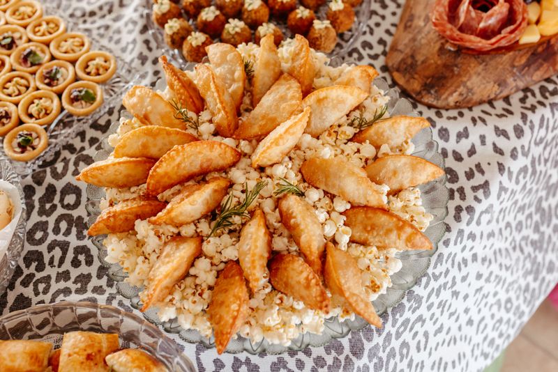 bowls of popcorn with various seasonings