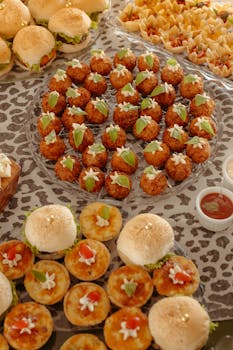 A high-angle view of an elegant spread of assorted gourmet snacks on a decorated table.
