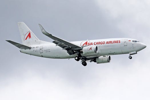 Boeing 737 from Asia Cargo Airlines flying against a cloudy sky.