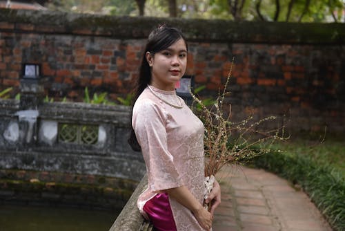 Woman Standing in Traditional Clothing