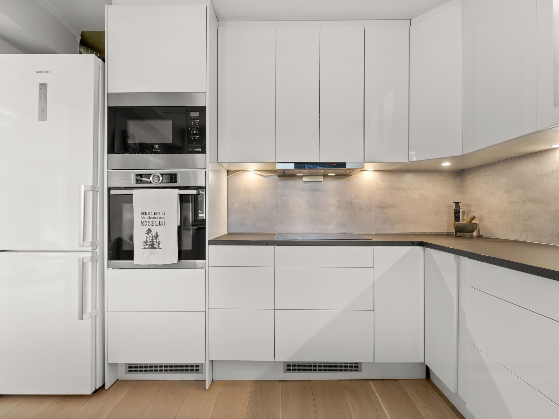 Kitchen Spraying in Lisson Grove — careful masking before painting begins