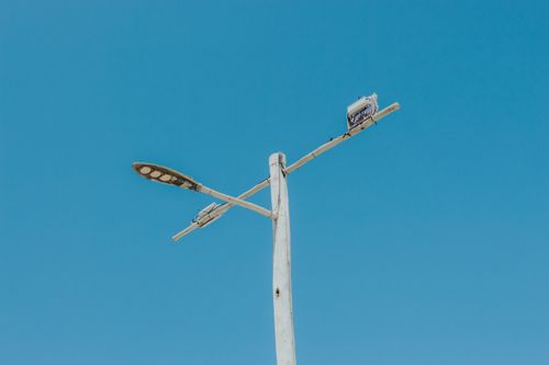 Free Minimalist view of a wooden lamppost against a clear blue sky in Majorlândia, Brazil. Stock Photo