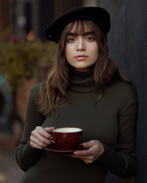 Young Woman Drinking Coffee