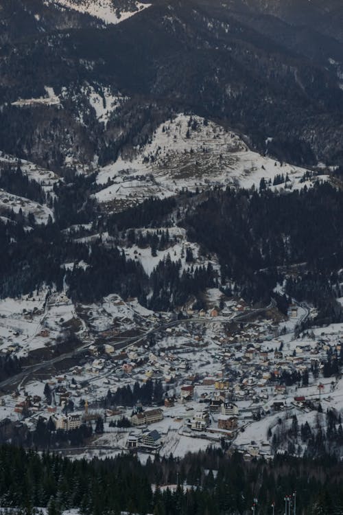 Town in a Valley at the Foot of a Mountain in Winter