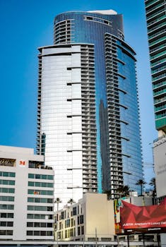 Modern skyscraper reflecting the dynamic urban landscape of Miami's city center.