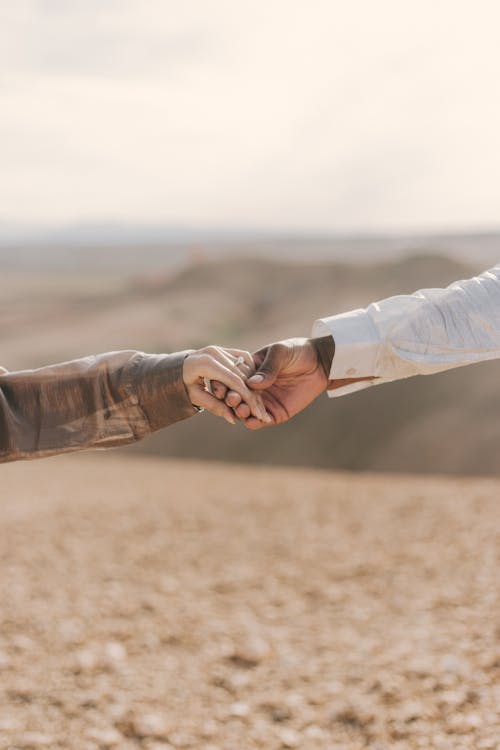 Couple Holding Hands on Desert