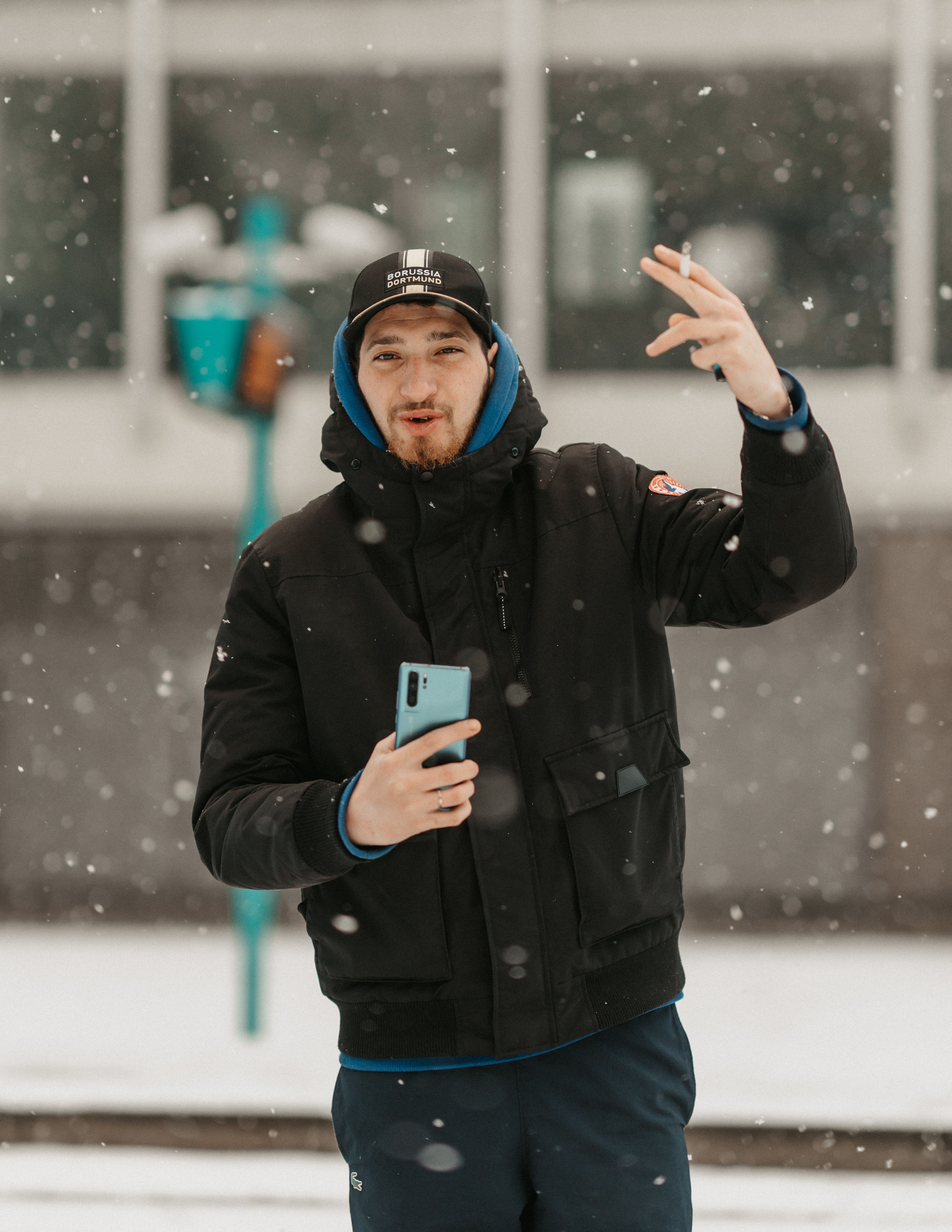 A Man Standing Outdoors in Winter · Free Stock Photo