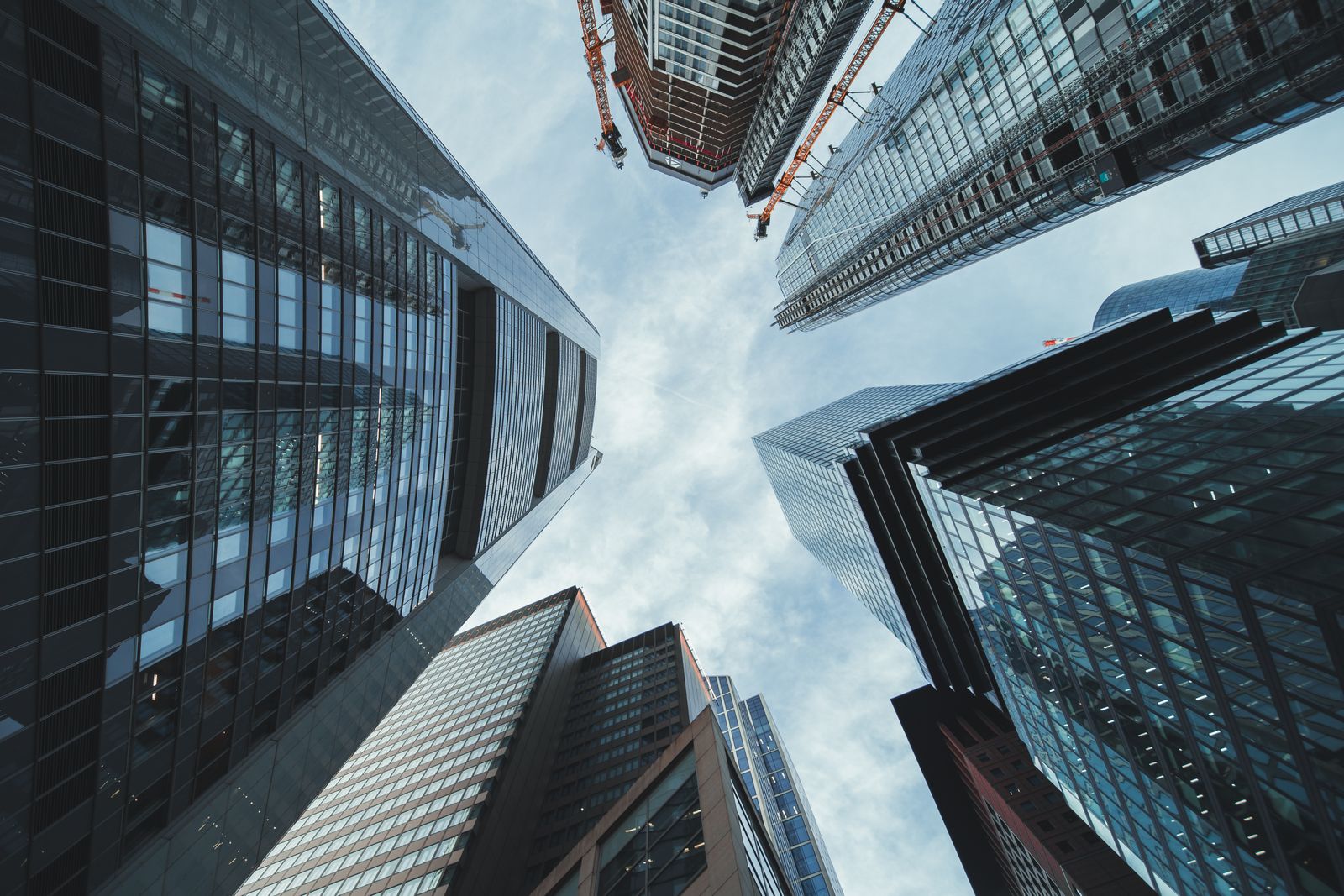 Looking up at modern corporate skyscrapers in a business district