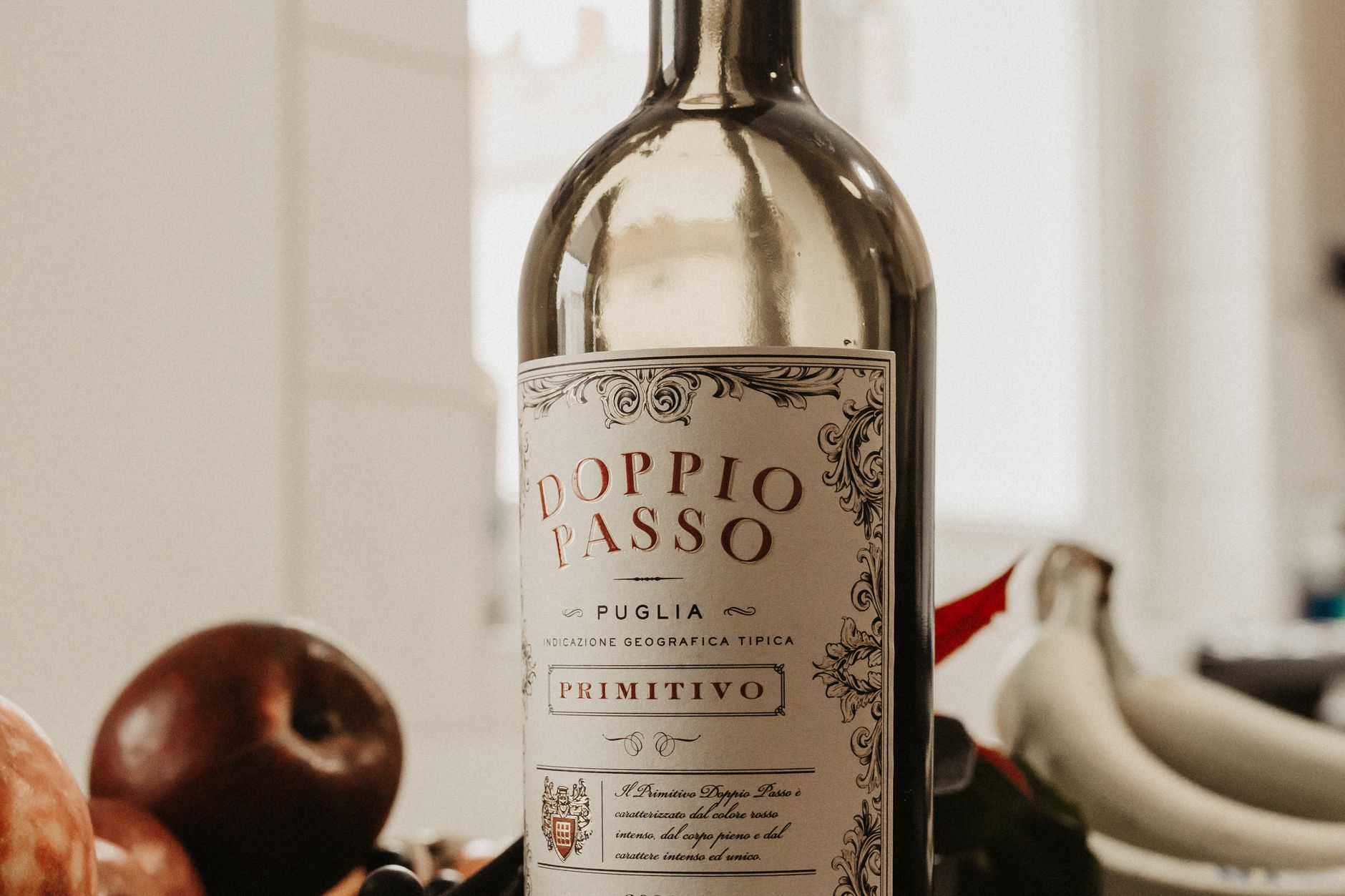 A close-up photograph of an Italian wine bottle label showing traditional text and aging classification markings.
