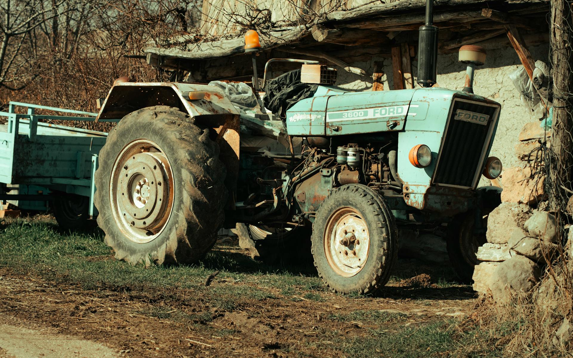 Old Tractor with Trailer in Countryside