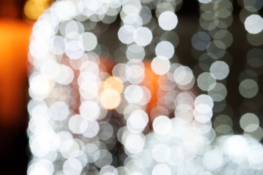 Blurry bokeh lights create an abstract festive pattern, perfect for holiday decor or background design.