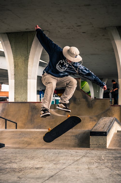Man on Mid Air Performing Skateboard Trick