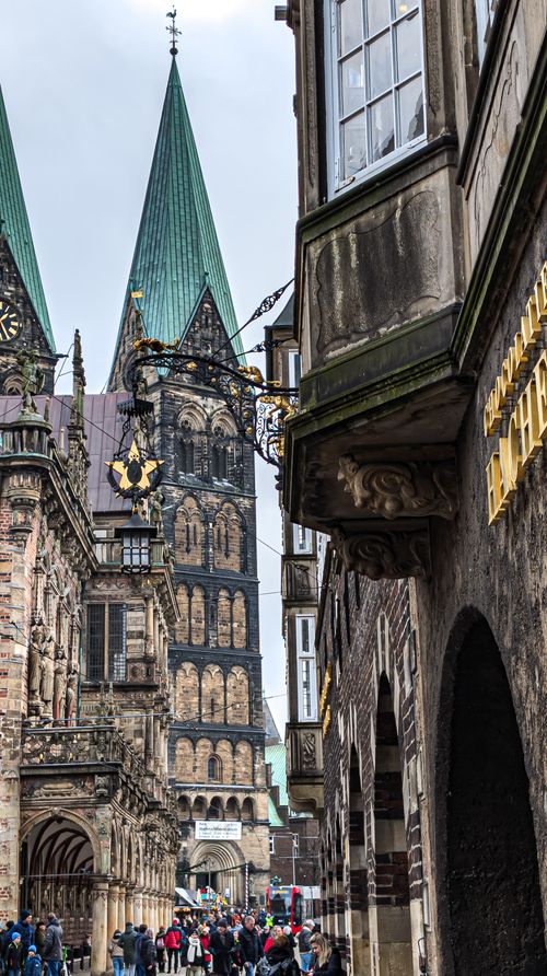 Free Vertical shot capturing gothic church towers and cityscape architecture. Stock Photo