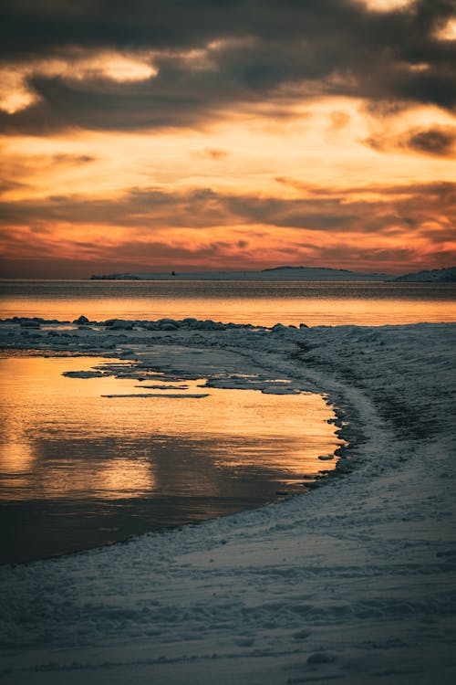 Free Sea Coast in Winter at Sunset Stock Photo