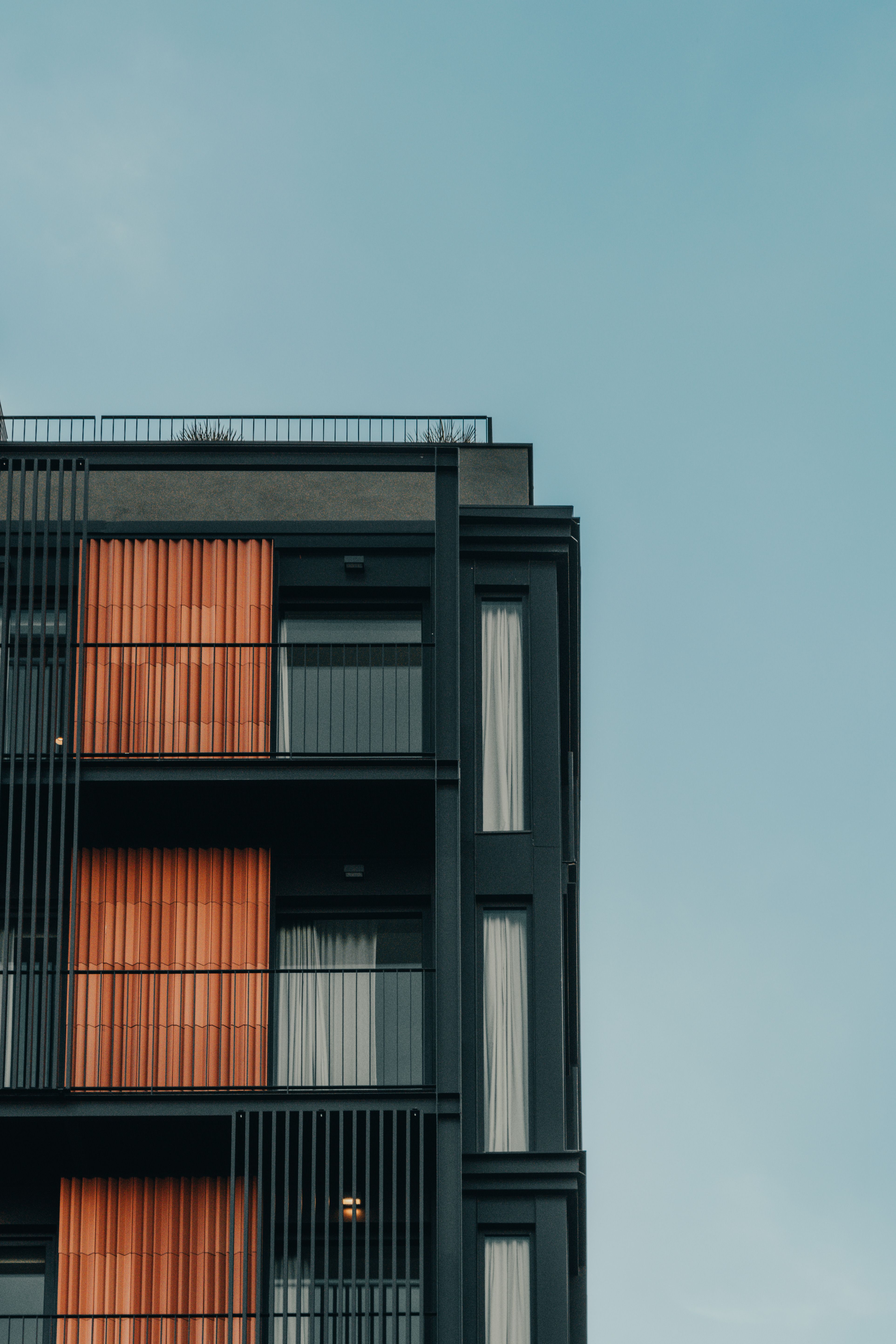 An apartment building with balconies and windows · Free Stock Photo