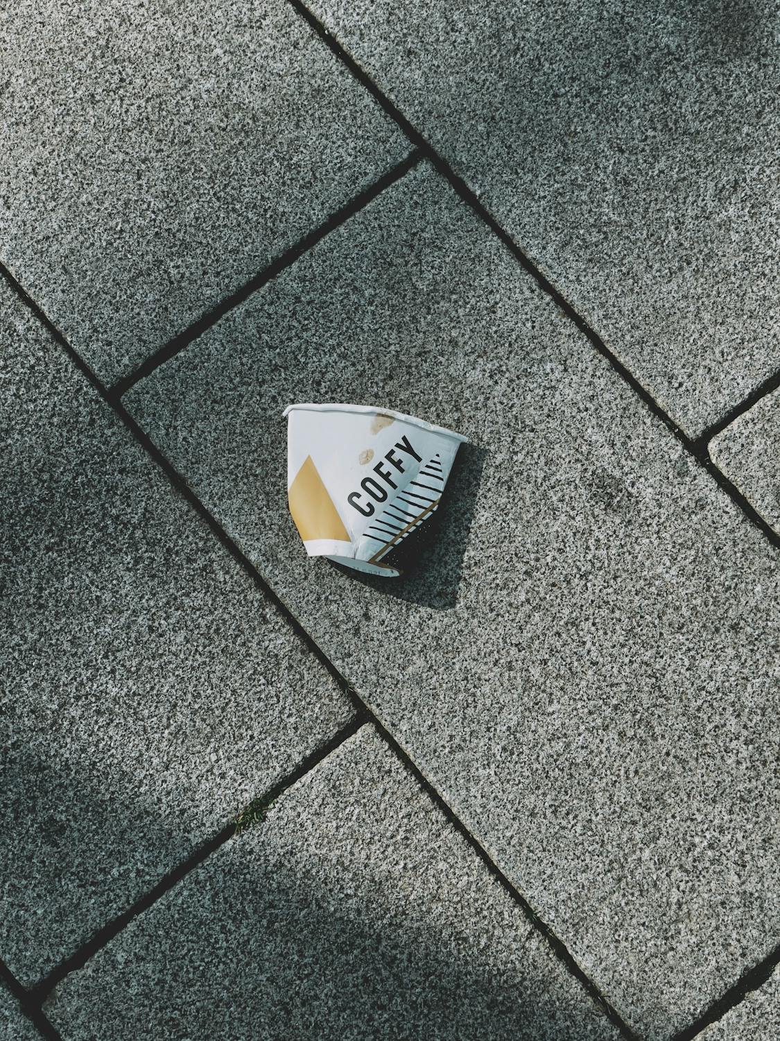 Paper Cup on Pavement · Free Stock Photo