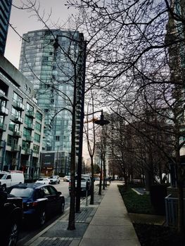 Discover the bustling street scene in downtown Vancouver showcasing modern buildings and urban life.