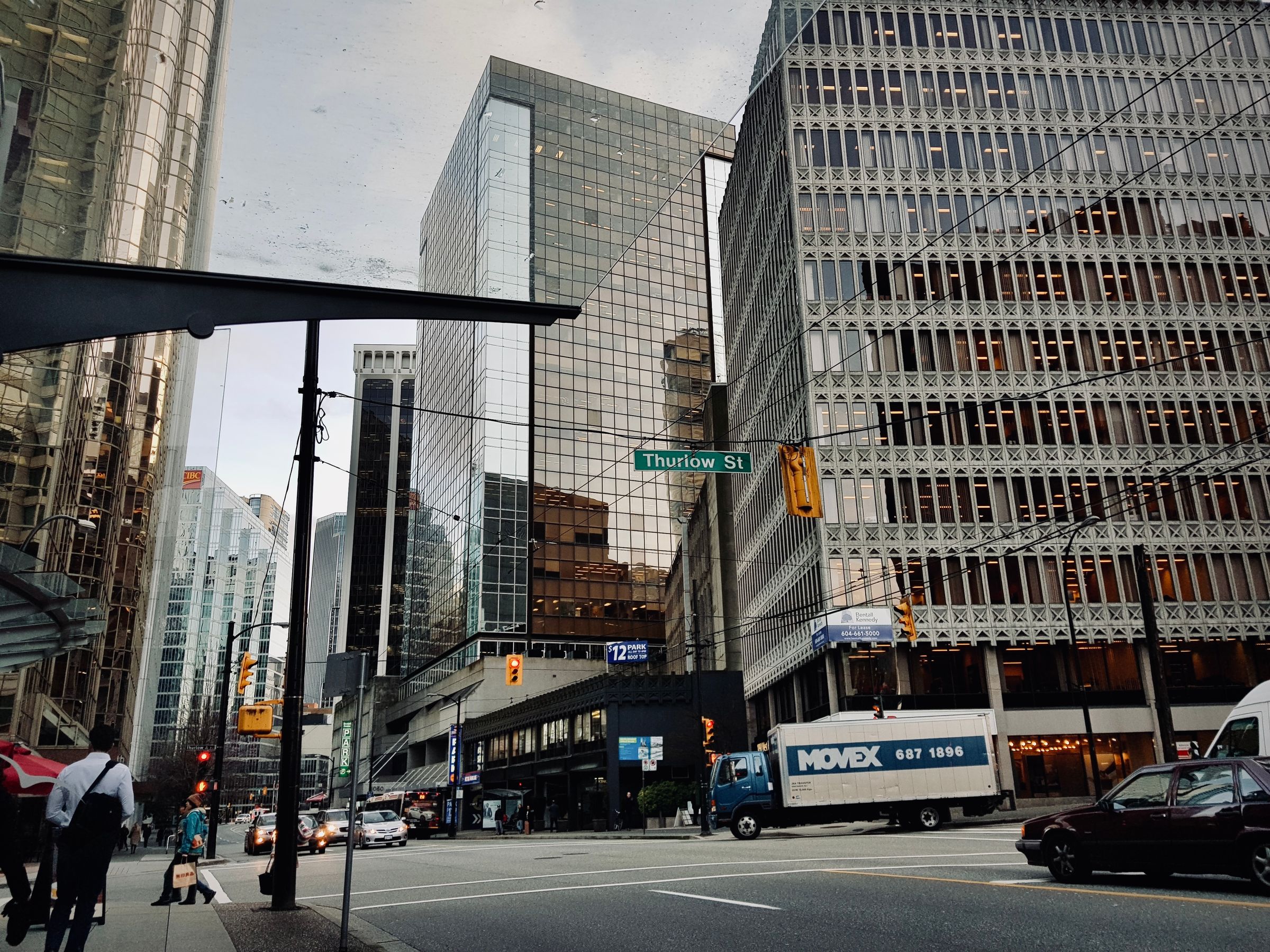 Renter checking a phone on a downtown Vancouver street