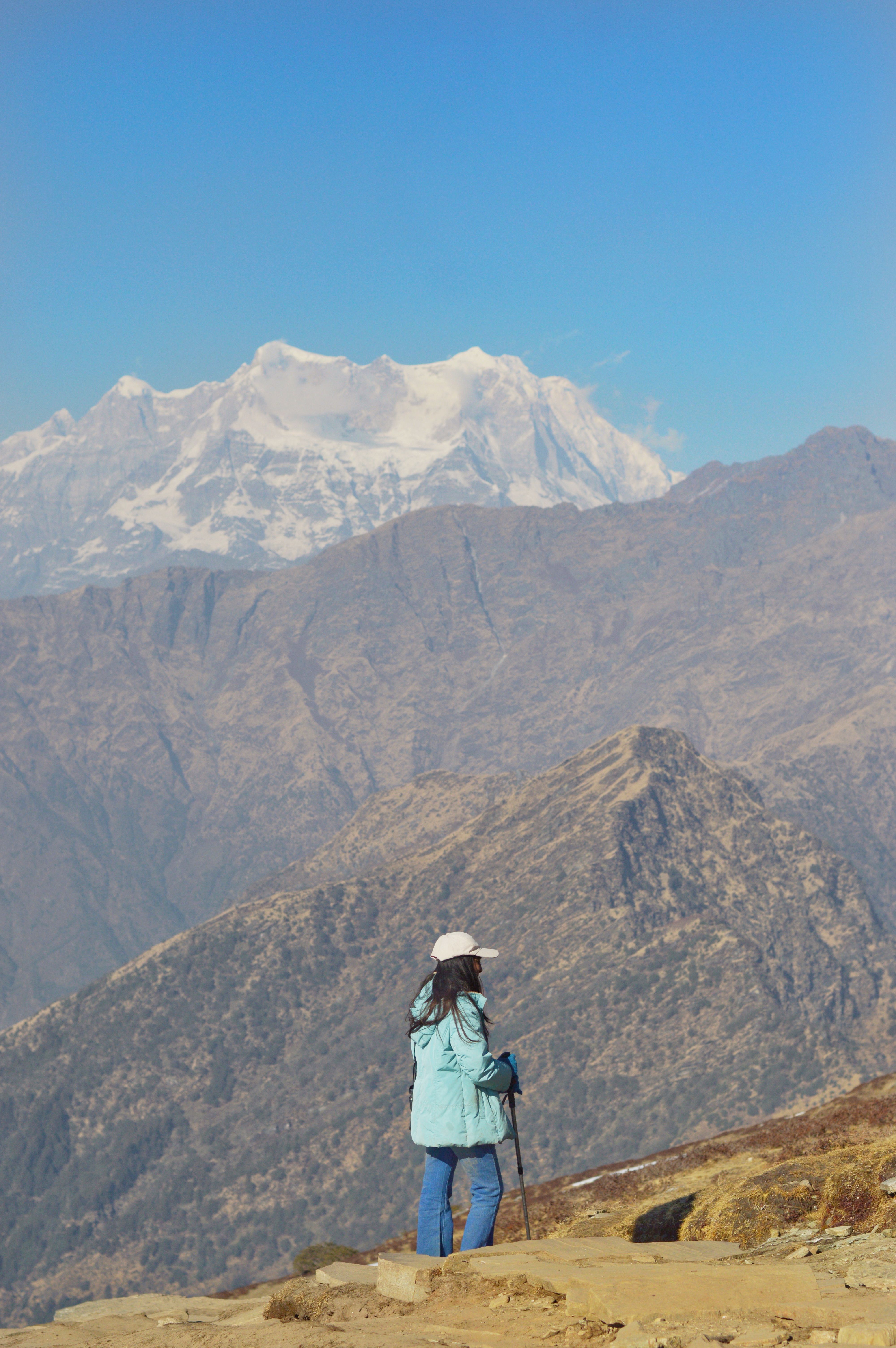 Back View of Woman Hiking in Mountains · Free Stock Photo