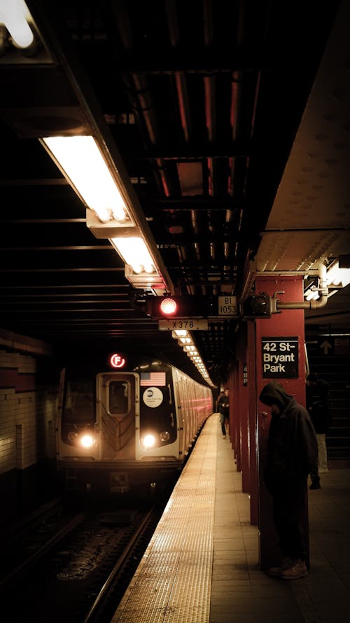 A subway train is pulling into a station