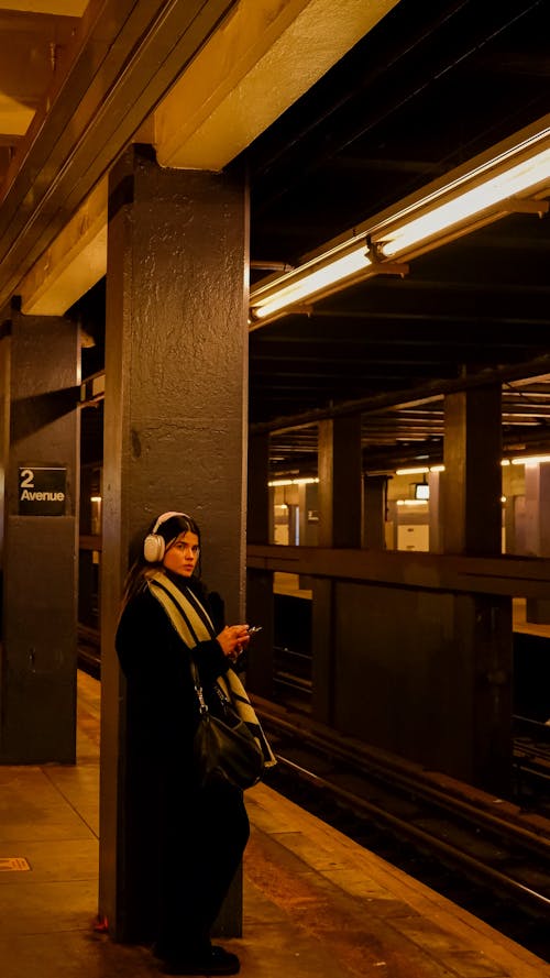  Young Woman Waiting on the Subway Station Platform