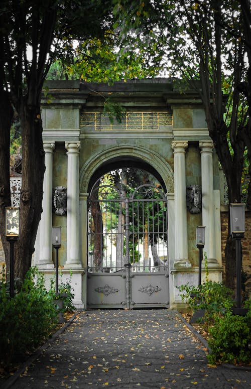 View of a Gate between Trees in a Park 