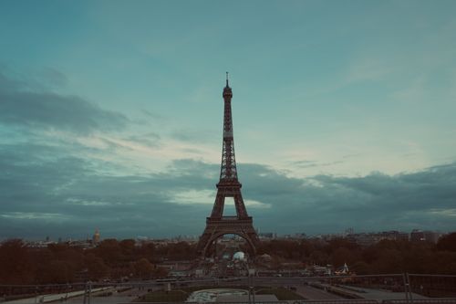 Free Scenic view of the Eiffel Tower against a twilight sky in Paris, France. Stock Photo