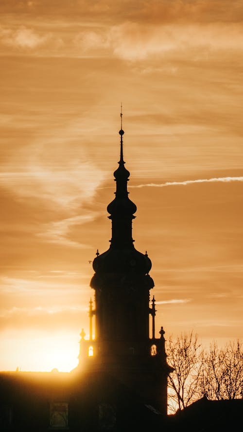 Church Tower Silhouette under Yellow Sky