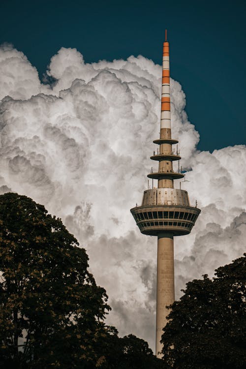 A tower with clouds in the background