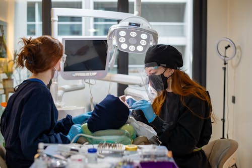 Dentists Examining a Patient at a Dental Clinic