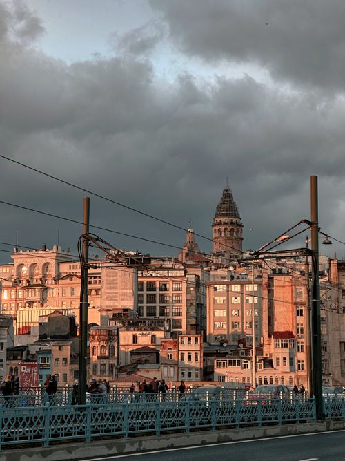 Free View of Galata Tower and urban landscape from Galata Bridge in Istanbul at sunset. Stock Photo
