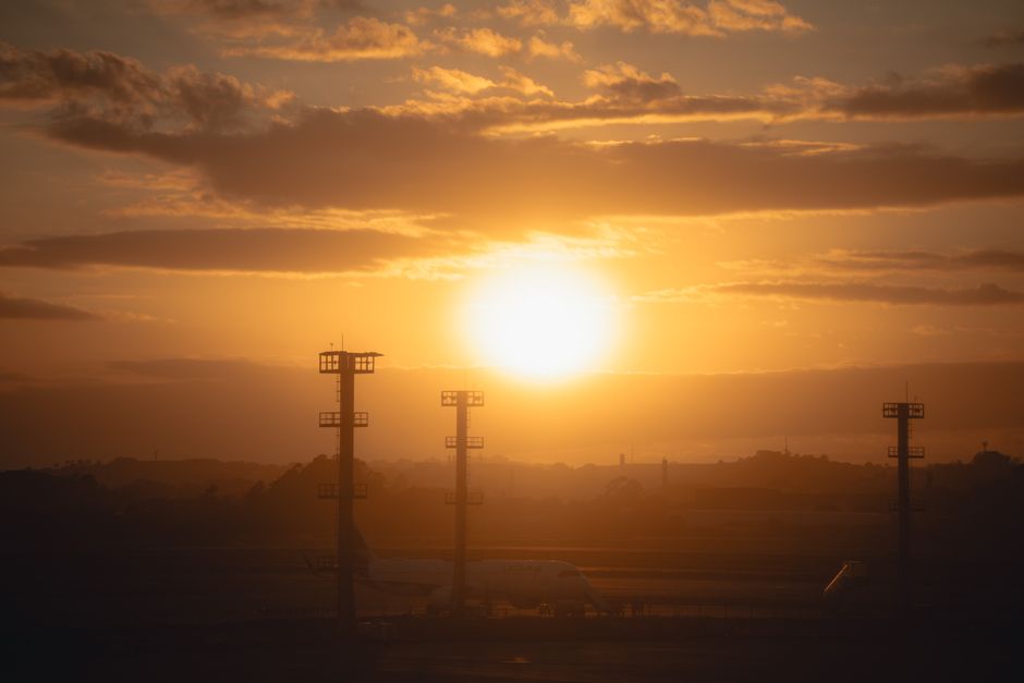 jet departure airfield sunset clouds