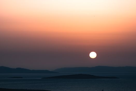 Stunning sunset over Ayvalık islands, capturing serene Aegean Sea views.