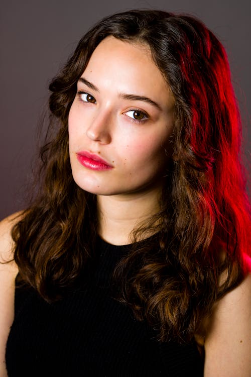 Teenage Female Closeup Seated Headshot Red Gel Hair Light Serious