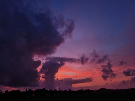 Breathtaking pink and purple sunset with dramatic clouds over MH, India.