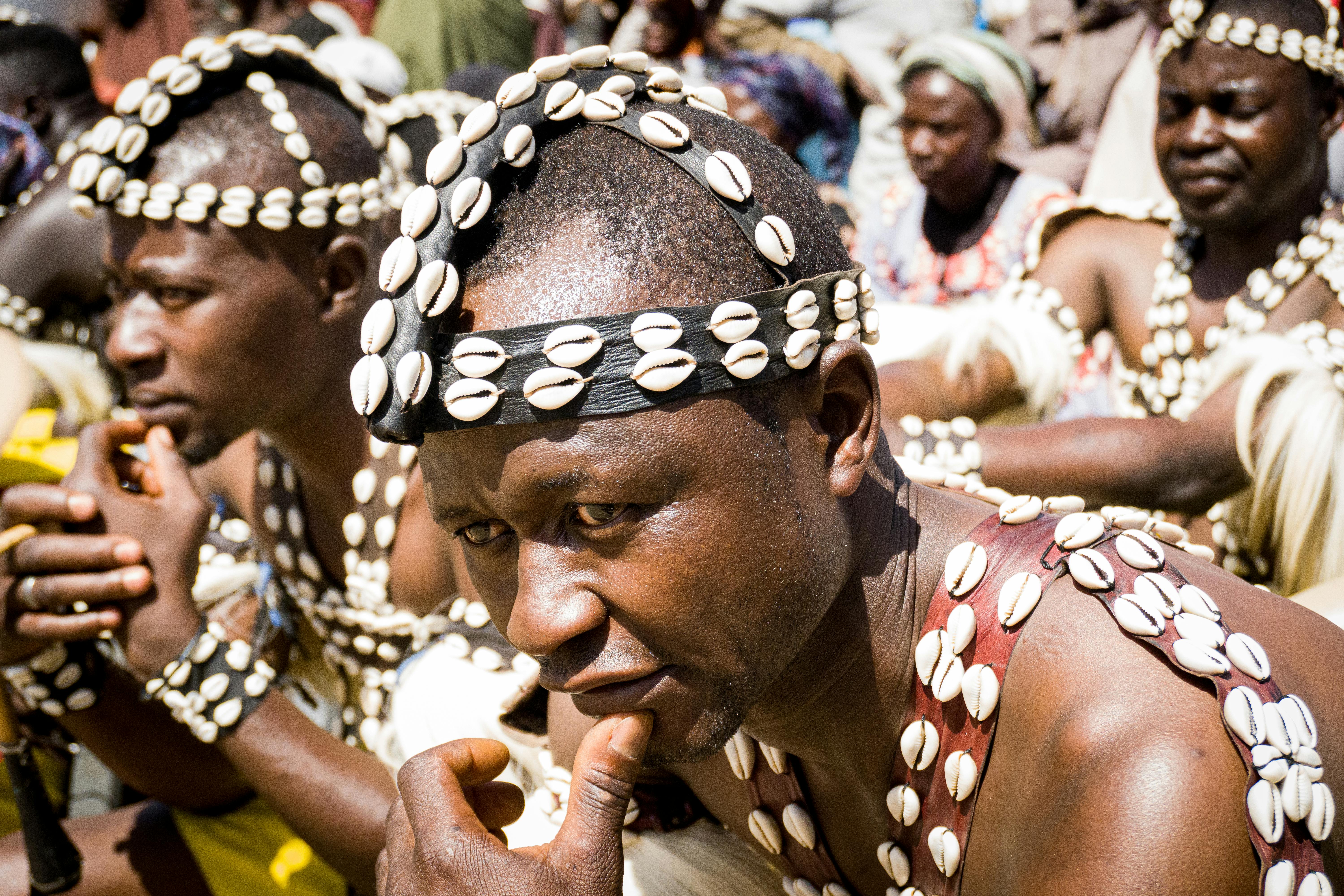 an african dancer looking determined and focused with hand on his chin