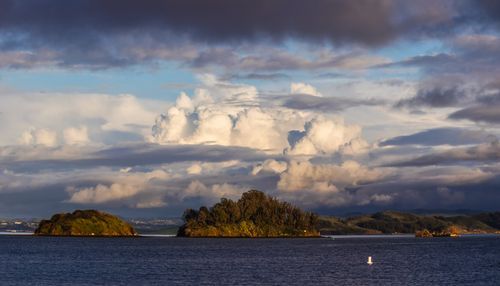 Free Breathtaking scene of islands with dramatic clouds over a calm sea, showcasing nature's beauty. Stock Photo
