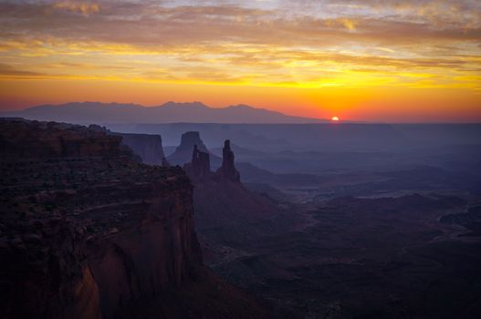 Stunning view of sunrise over the majestic canyons at Canyonlands National Park in Moab, Utah.