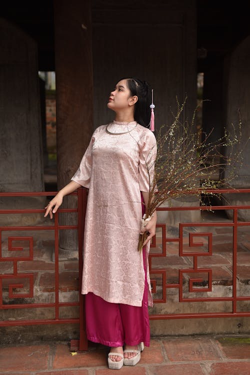 Woman in Pink Traditional Clothing 