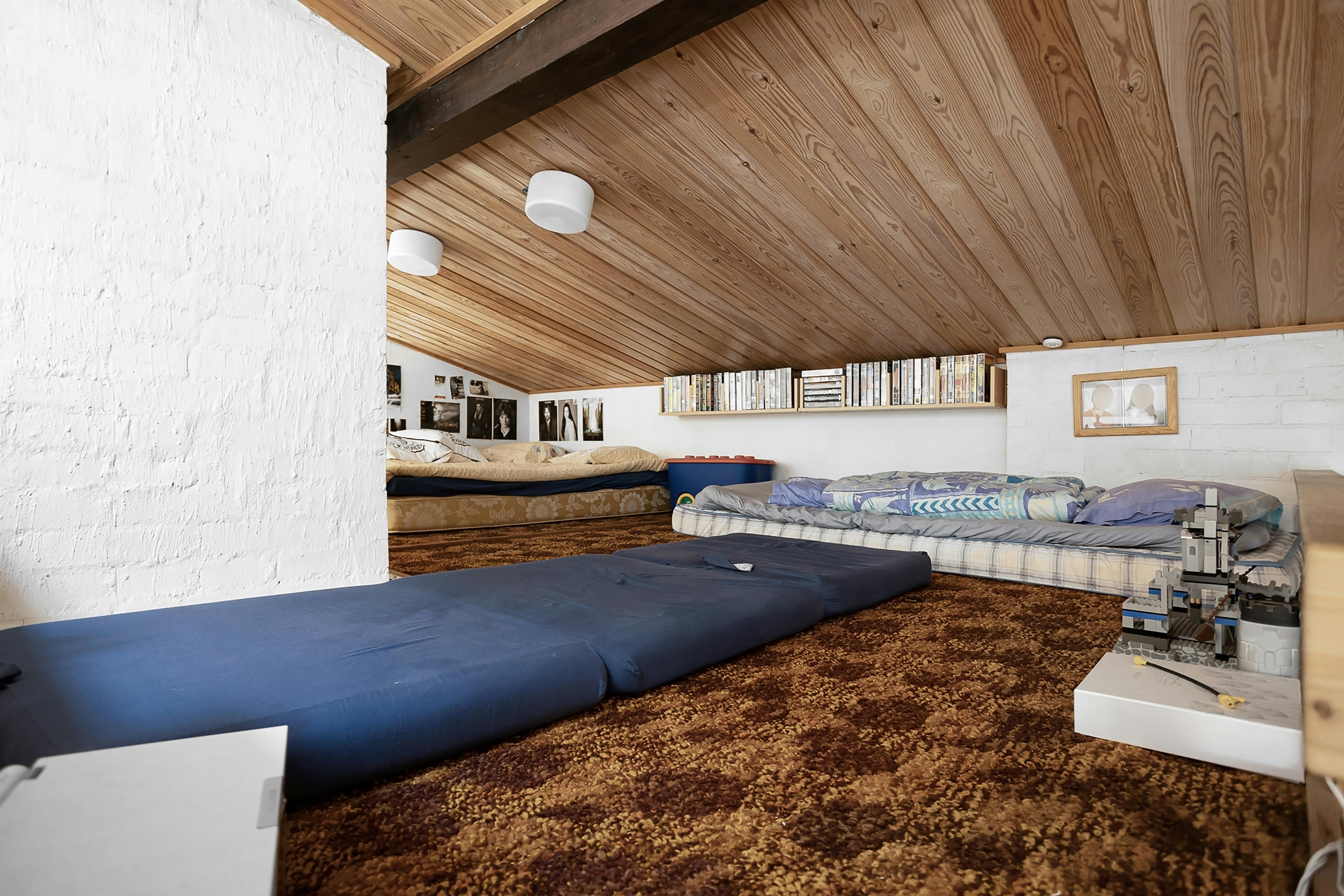 Bedroom With Sloped Ceiling And Uplighting