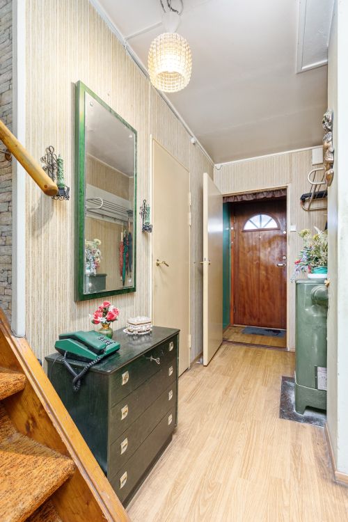 Free Cozy vintage home corridor featuring a mirror, dresser, and wooden elements. Stock Photo