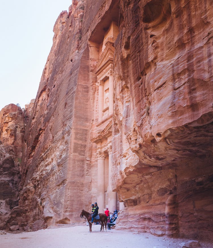 Two Person Riding Horse Near Petra Jordan