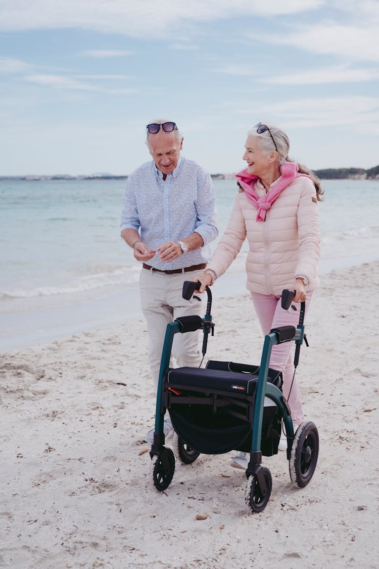 Elderly Couple Walking At The Beach