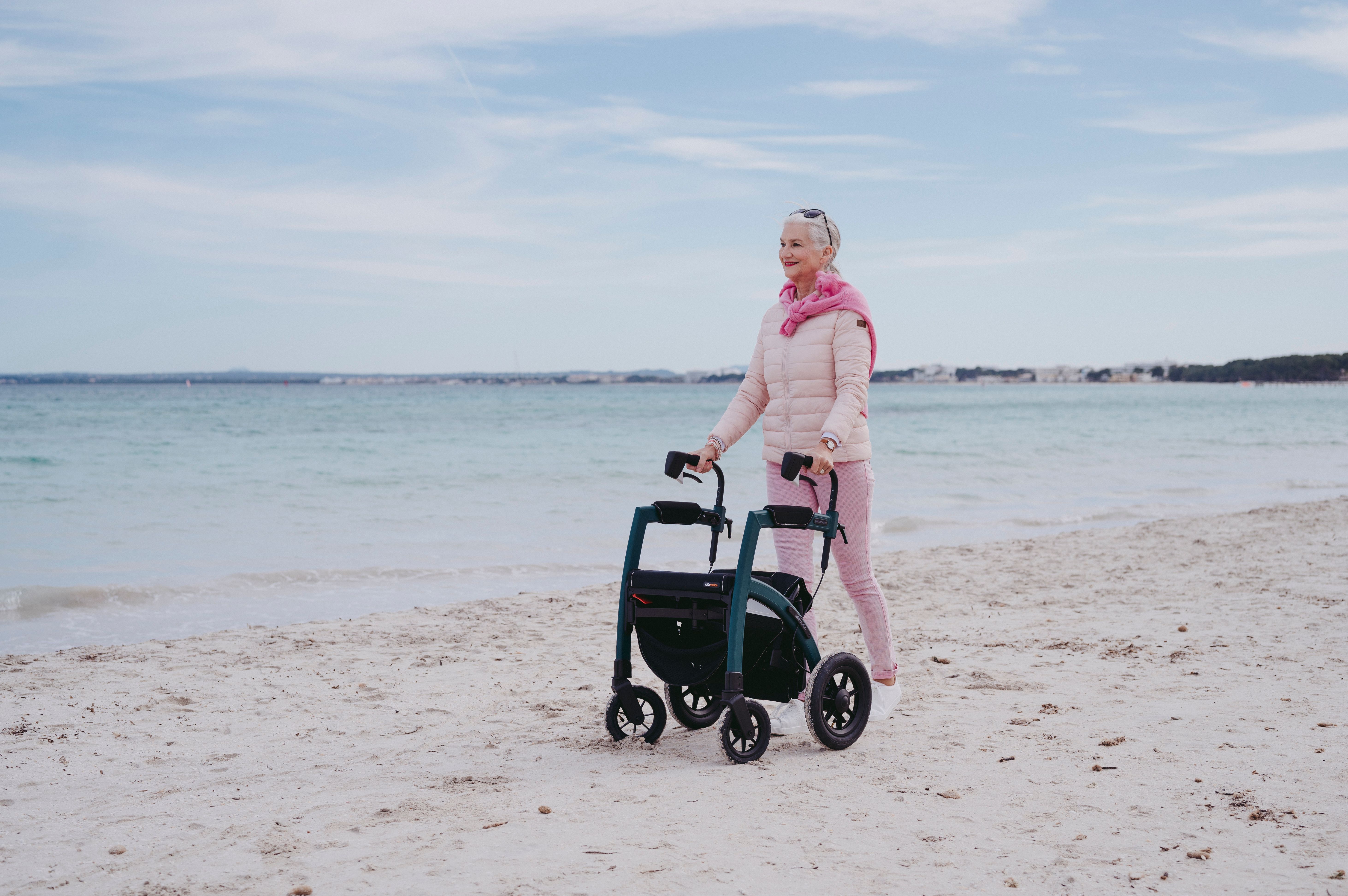 Smiling Woman with Walker on Beach · Free Stock Photo