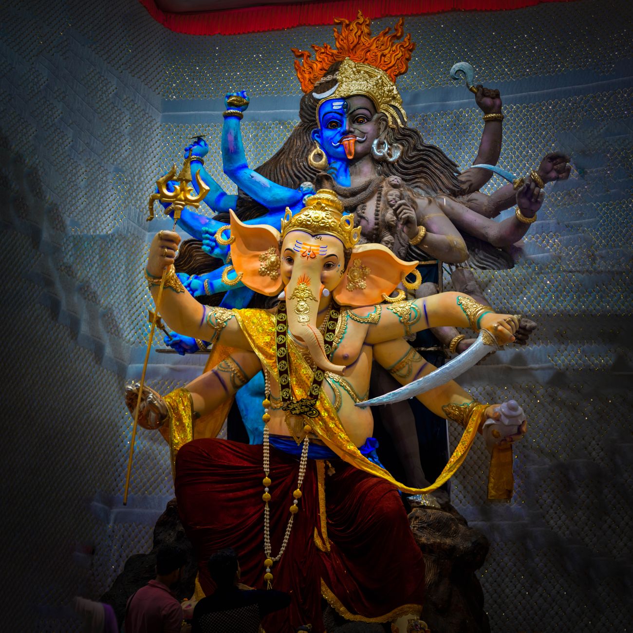 Colorful statue of Ganesh with intricate details, showcasing Hindu mythology and artistic expression.