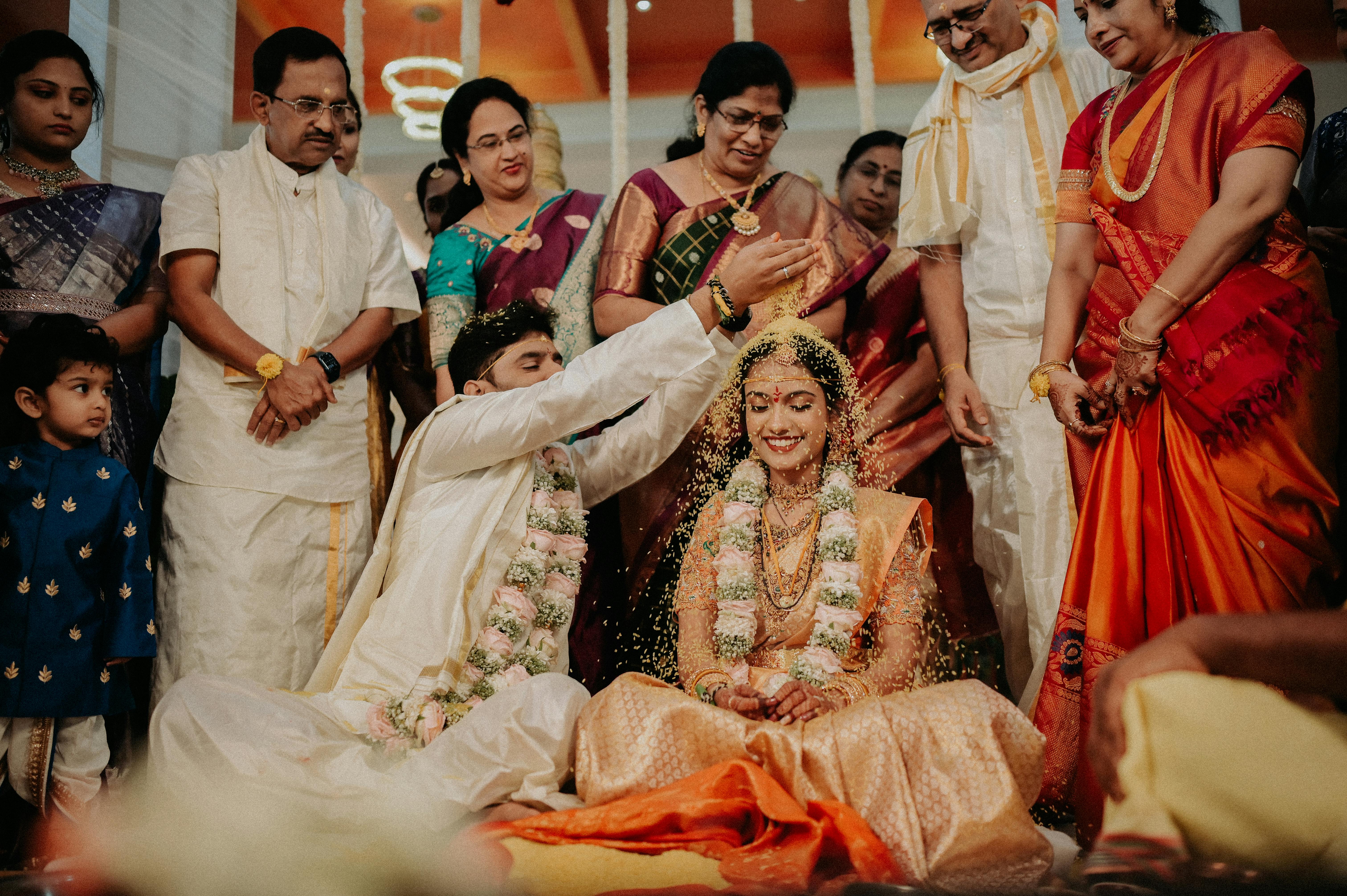 Vibrant traditional South Asian wedding ceremony with joyful gathering and cultural attire.